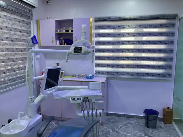Dental treatment room with chair and monitor in Ota